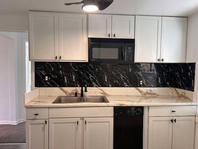 kitchen featuring white cabinets, sink, decorative backsplash, and black appliances