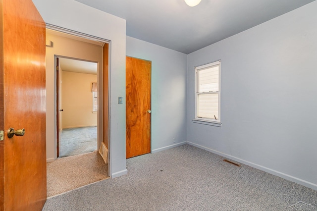 unfurnished bedroom featuring carpet