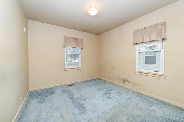 empty room with carpet flooring