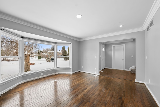 spare room with crown molding and dark hardwood / wood-style floors