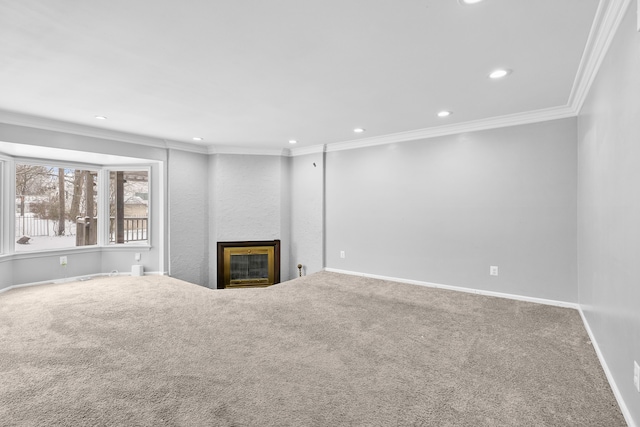 unfurnished living room featuring ornamental molding and carpet floors