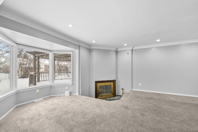 unfurnished living room featuring crown molding and carpet