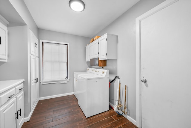 laundry room featuring cabinets and washing machine and clothes dryer