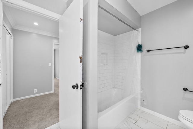 bathroom featuring ornamental molding, shower / tub combo, and toilet