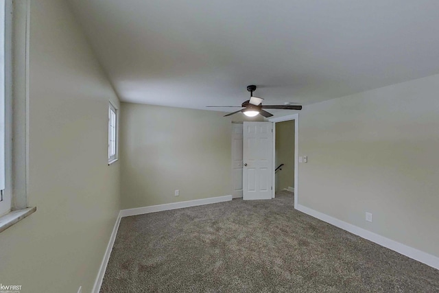 unfurnished room featuring ceiling fan and carpet flooring