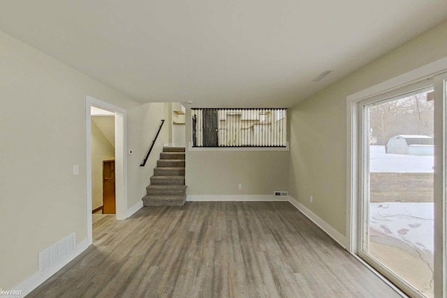 unfurnished living room featuring hardwood / wood-style flooring