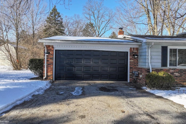 view of snow covered garage