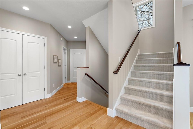 stairs with wood-type flooring