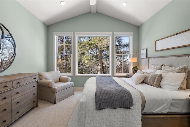 carpeted bedroom with vaulted ceiling