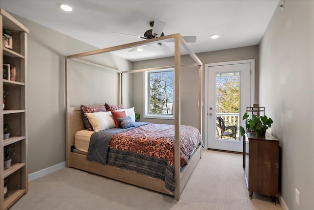 bedroom with ceiling fan, light colored carpet, and access to outside