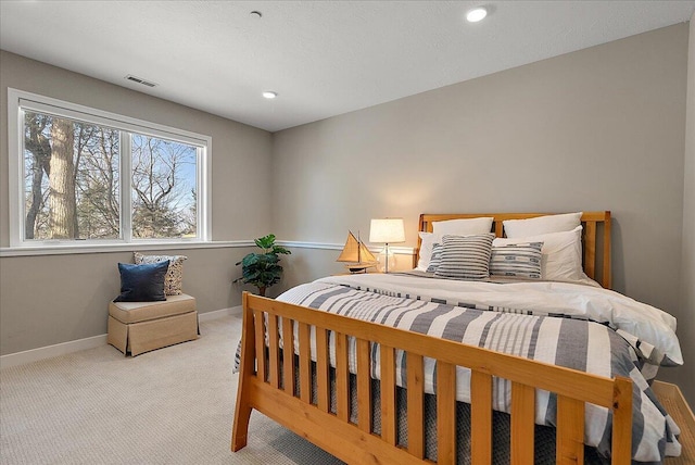 bedroom featuring light colored carpet