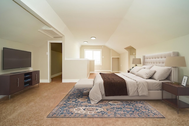 carpeted bedroom with vaulted ceiling