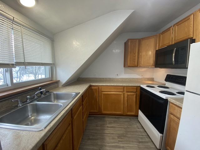 kitchen featuring white fridge, electric range oven, sink, and dark wood-type flooring