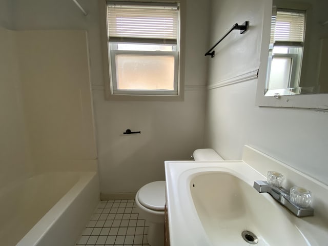 bathroom with tile patterned flooring, sink, and toilet