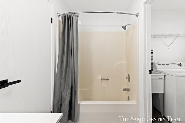 bathroom featuring vanity, washer / dryer, and shower / bath combination with curtain