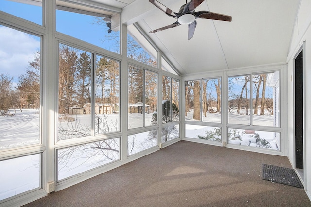 unfurnished sunroom featuring vaulted ceiling with beams and ceiling fan