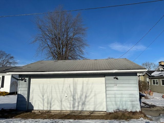 view of snow covered garage