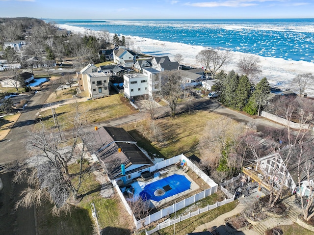 drone / aerial view with a beach view and a water view