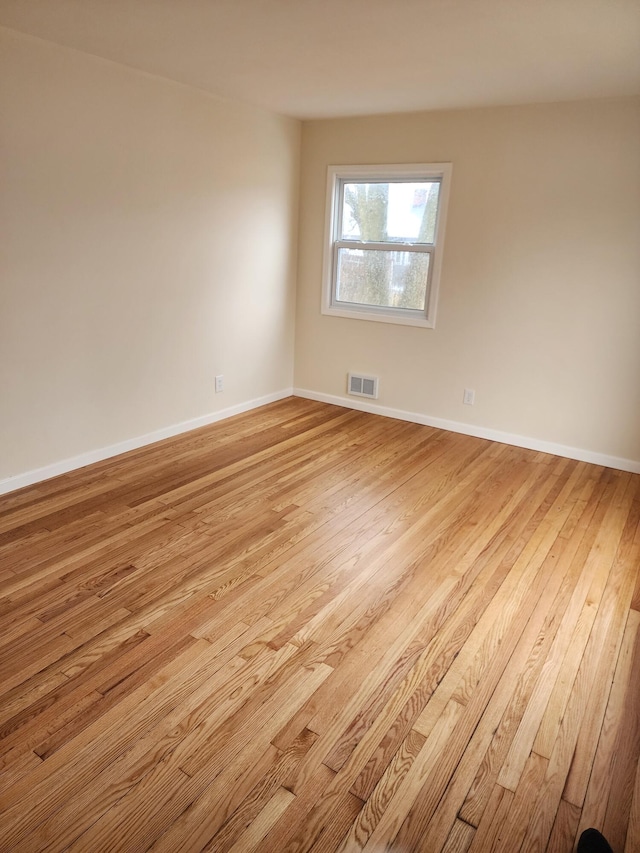 empty room featuring light hardwood / wood-style floors