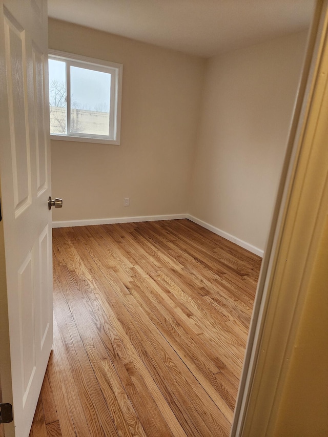 unfurnished room with light hardwood / wood-style flooring