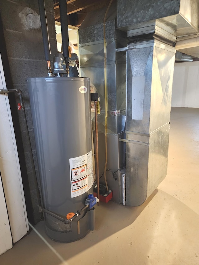 utility room featuring gas water heater