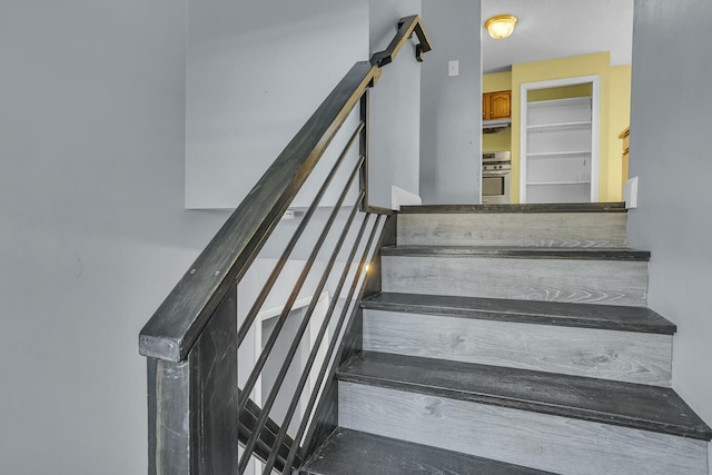 stairs featuring a barn door