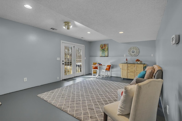 living area with a textured ceiling