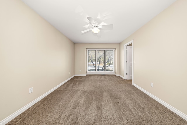 empty room with carpet floors and ceiling fan