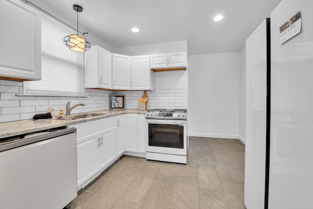 kitchen with dishwasher, white cabinets, hanging light fixtures, light stone countertops, and stainless steel range with gas stovetop