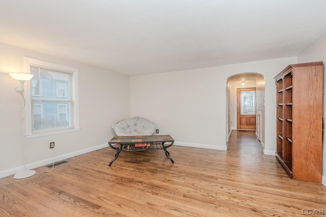 living area with light hardwood / wood-style flooring