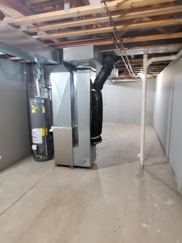 basement with water heater and heating unit