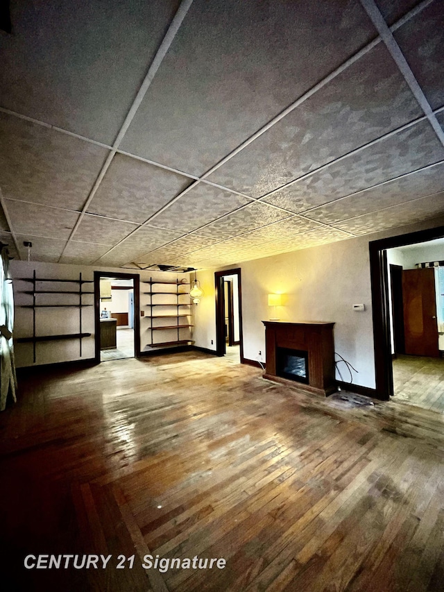 unfurnished living room featuring hardwood / wood-style flooring