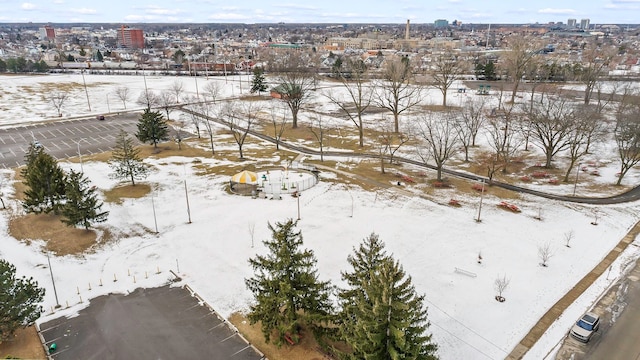 snowy aerial view with a view of city