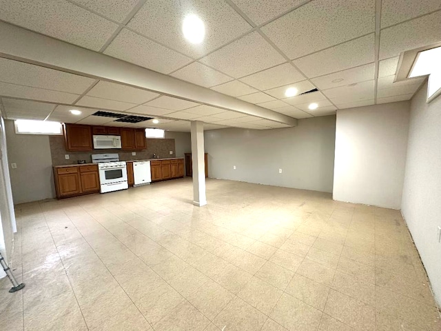 finished basement with a drop ceiling and light floors