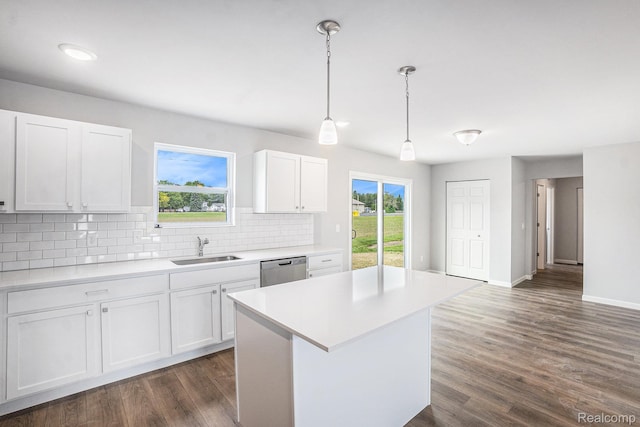 730 Natalia Dr, Davison, MI 48423 - kitchen with stainless steel dishwasher, light countertops, tasteful backsplash, white cabinetry, and recessed lighting