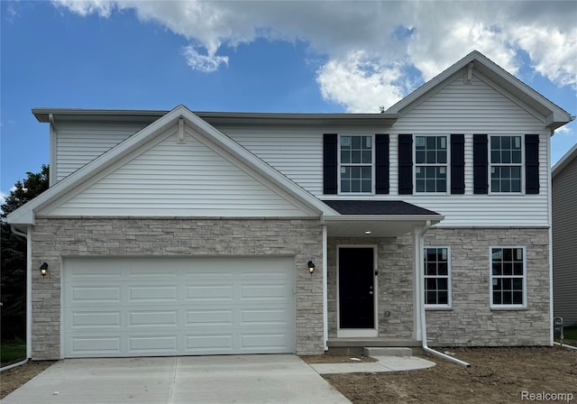730 Natalia Dr, Davison, MI 48423 - traditional-style home with stone siding, concrete driveway, and a garage
