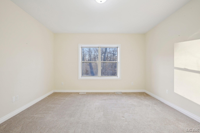 empty room featuring light colored carpet