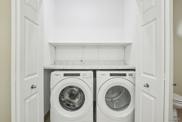 washroom with washing machine and dryer