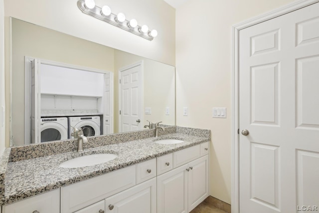 bathroom with vanity and independent washer and dryer