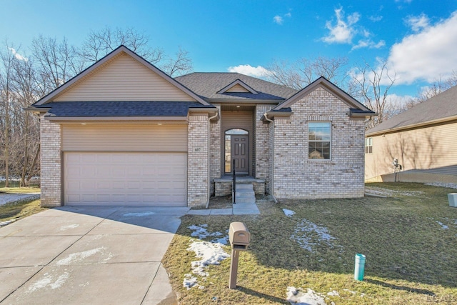 view of front of house with a garage and a front yard