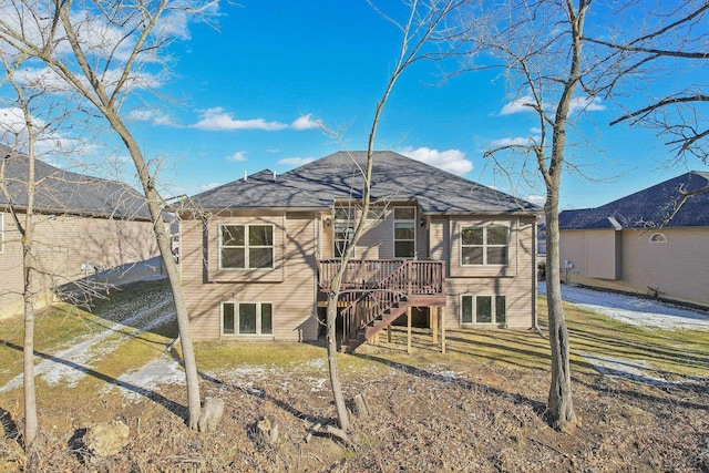 rear view of property featuring a deck