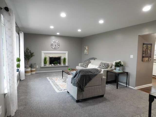 living room with dark colored carpet