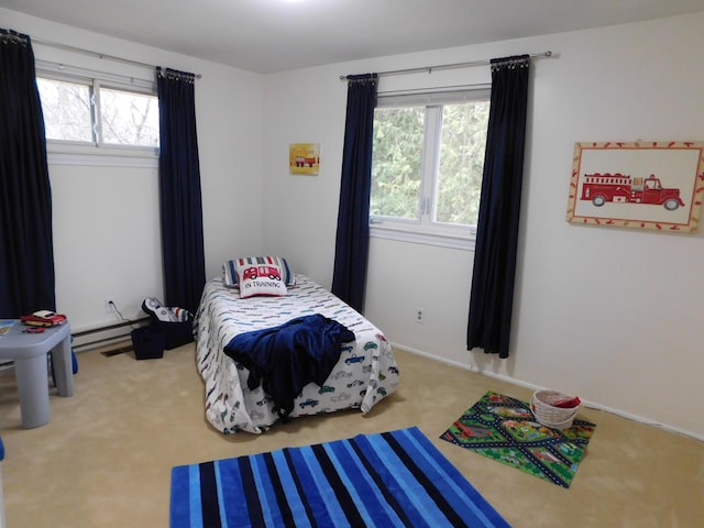 bedroom featuring multiple windows and carpet flooring