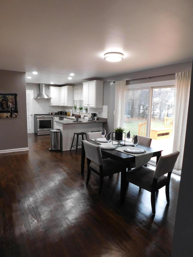 dining area featuring dark hardwood / wood-style flooring