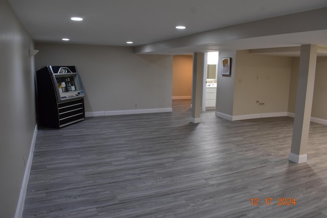 basement featuring dark hardwood / wood-style floors