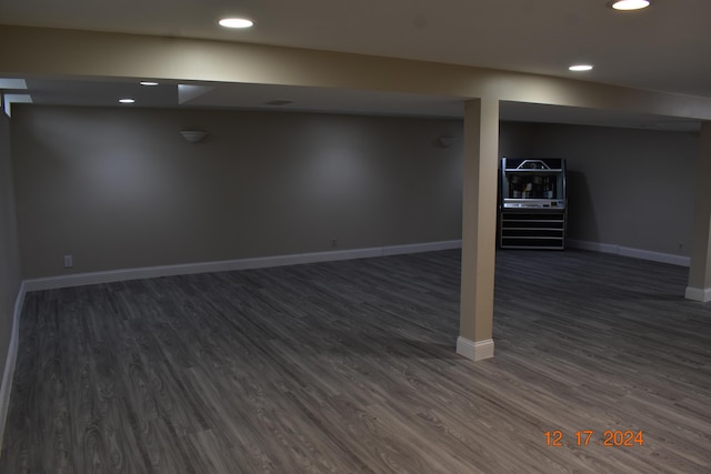 basement featuring dark hardwood / wood-style floors