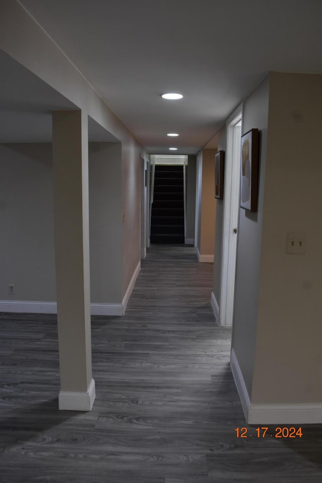 hall with dark wood-type flooring