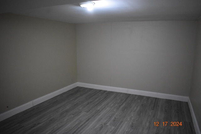 spare room with dark hardwood / wood-style floors