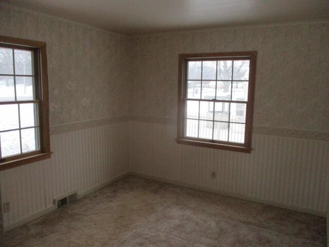 unfurnished room with light carpet