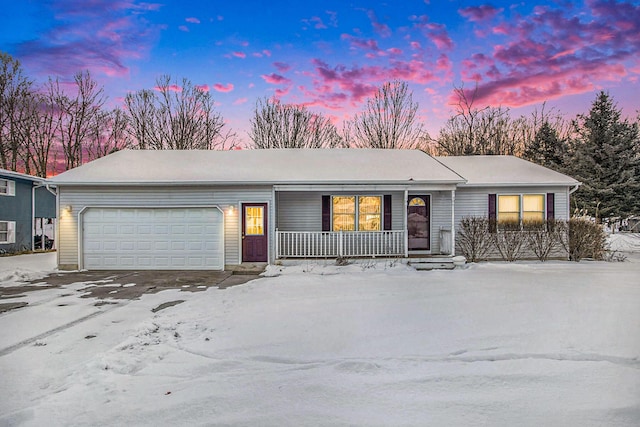 ranch-style house with a garage and covered porch